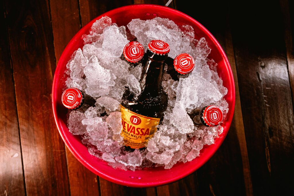 Ice bucket with multiple beer bottles chilling, perfect for gatherings and parties.