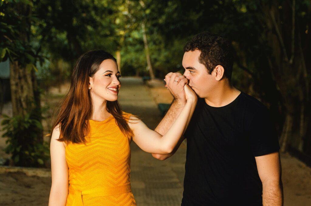 A loving couple shares a tender moment outdoors, symbolizing romance and connection.
